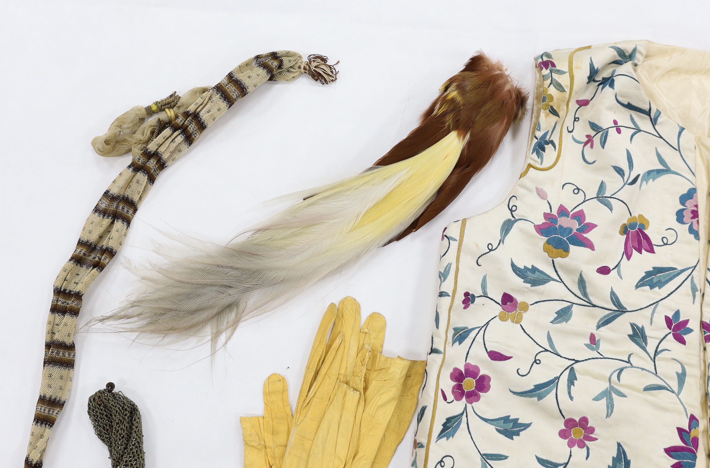 A collection of eight late 18th / early 19th century cut steel and other misers purses, a pair of yellow Regency ladies long shami leather gloves, an exotic feather hat ornament and a Chinese embroidered young boys waist